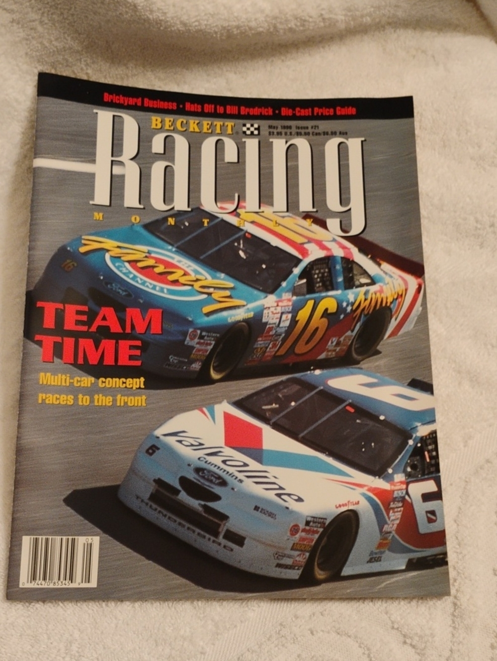 Beckett Racing Magazine Cover with Blue, White, Red and Yellow Race Cars